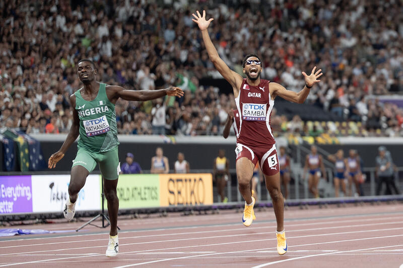 Bronze medalist Abderrahman SAMBA of Qatar (R) crosses the line with Ezekiel NATHANIEL of Nigeria (L) in the 400 Metres Hurdles Men Final at the World Athletics Championships in Tokyo, Japan on September 19, 2025. Matrix Images / Nic Bothma
