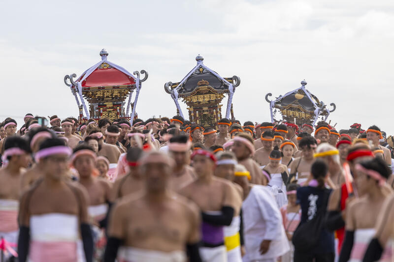Participants take part in the Ohara Hadaka Matsuri festival in Ohara, Chiba, Japan on September 23, 2025. The festival held on 23–24 September 2025 in the coastal town of Ohara, Chiba, is a centuries-old Shinto festival with origins in the Edo period. Traditionally, the event is a communal prayer for a bountiful harvest and a successful fishing season, reflecting the deep connection between coastal communities and the natural world. Participants, wearing only the traditional fundoshi loincloths, carry heavy mikoshi (portable shrines) through the streets in a lively procession, accompanied by chants, drums, and the energy of the crowd. The festival’s most dramatic moment is the Shiofumi ritual, in which the shrine-bearers wade into the Pacific Ocean, braving the waves as an act of devotion and purification, symbolically linking human effort to the forces of nature. The festival concludes with a lantern-lit parade through the streets and a farewell ceremony, creating a striking visual spectacle at sunset. As part of Japan’s broader tradition of hadaka matsuri or Naked Festivals, the Ohara Matsuri emphasizes endurance, faith, and community solidarity, while preserving regional identity and continuity from the Edo period to the present. Celebrated at the start of autumn, the timing also aligns with Japan’s seasonal cycles, marking the transition from the harvest season to the cooler months and highlighting a cultural rhythm that honors nature’s cycles, human labor, and the enduring spiritual connection between people and the sea. Matrix Images / Simon Bonny