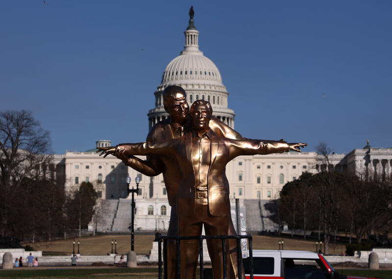 Jeffrey Epstein and US President Donald Trump statue in Washington, DC, USA.