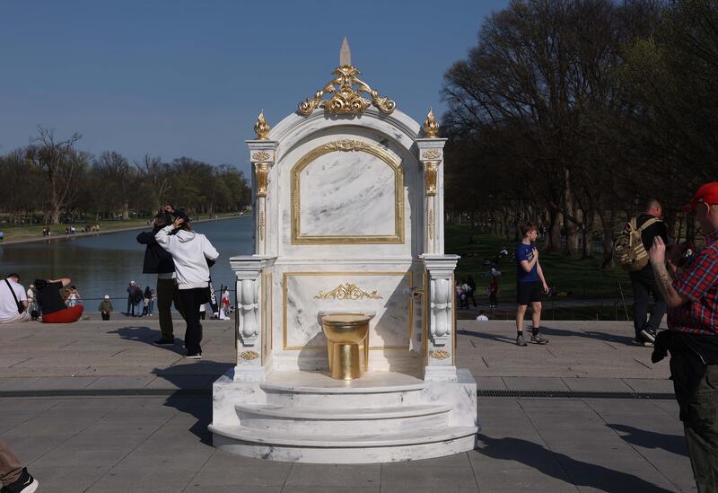 Golden toilet artwork appears in Washington, DC