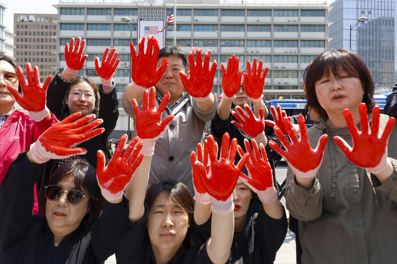 Red hands rally in Seoul against U.S.-Israeli strikes